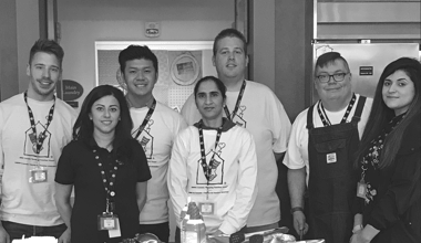 Group of Reyes Holdings team members gathered together.