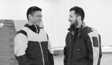 Two Martin Brower team members chatting together.