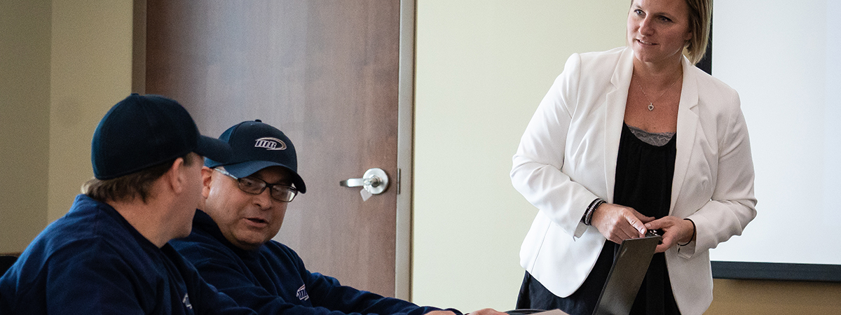 Martin Brower employees gathered together in training room.