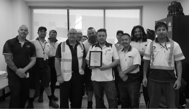 Martin Brower's MB Academy team members gathered together with an award.