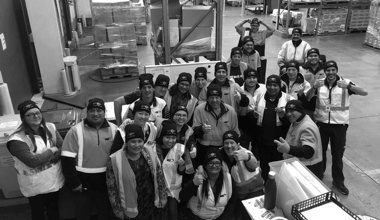 Group of Martin Brower team members gathered in a warehouse.
